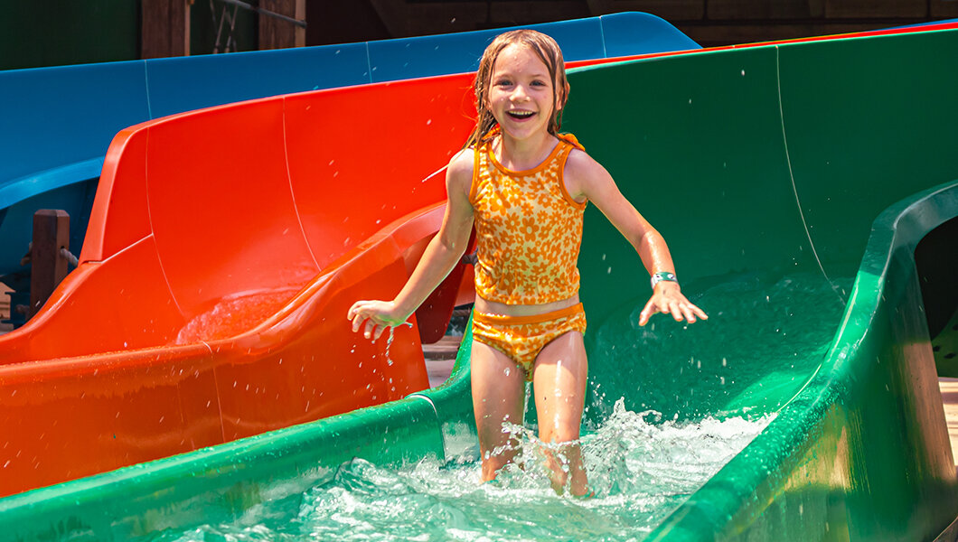 A young girl on a slide at the Massanutten Indoor WaterPark