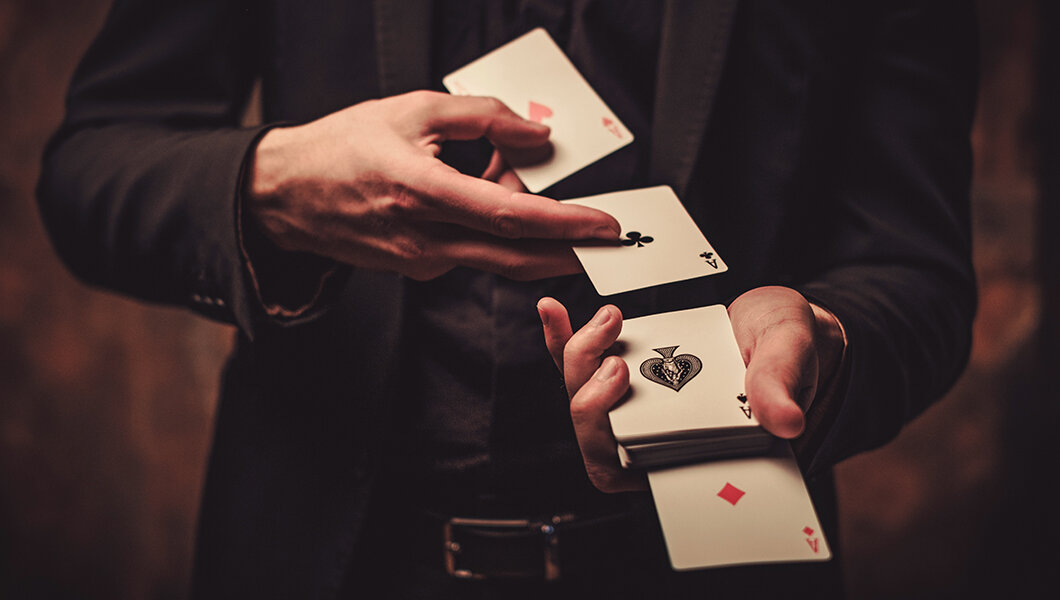 A Magician doing a card trick