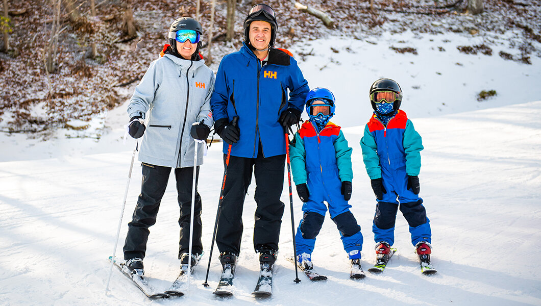 A family skiing at Massanutten Resort