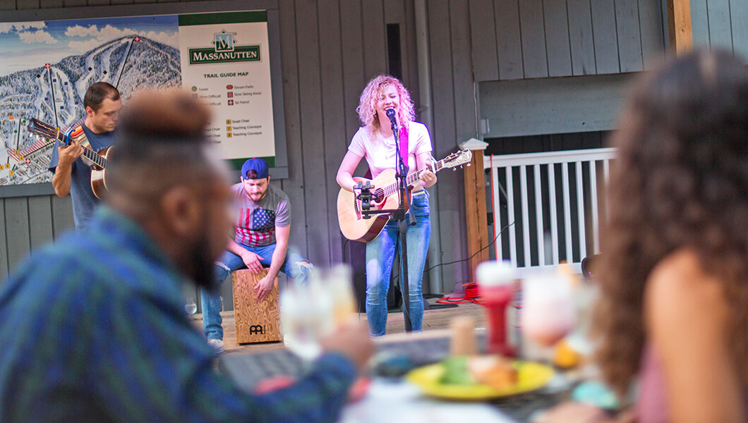 Guests enjoying live music at Base Camp